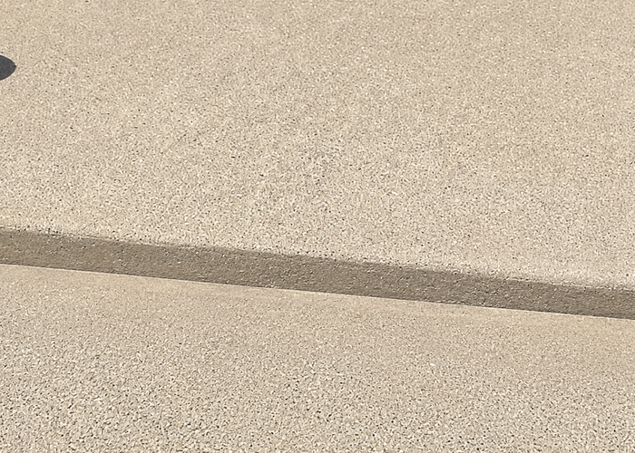 Heaving uneven sidewalk panels before repair